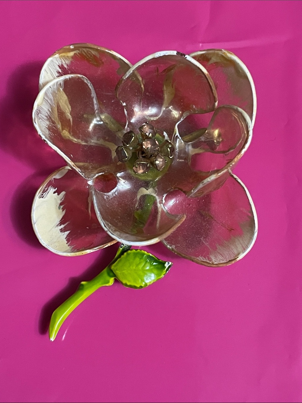 Vintage tinted clear plastic, amber rhinestones and enamel stem brooch